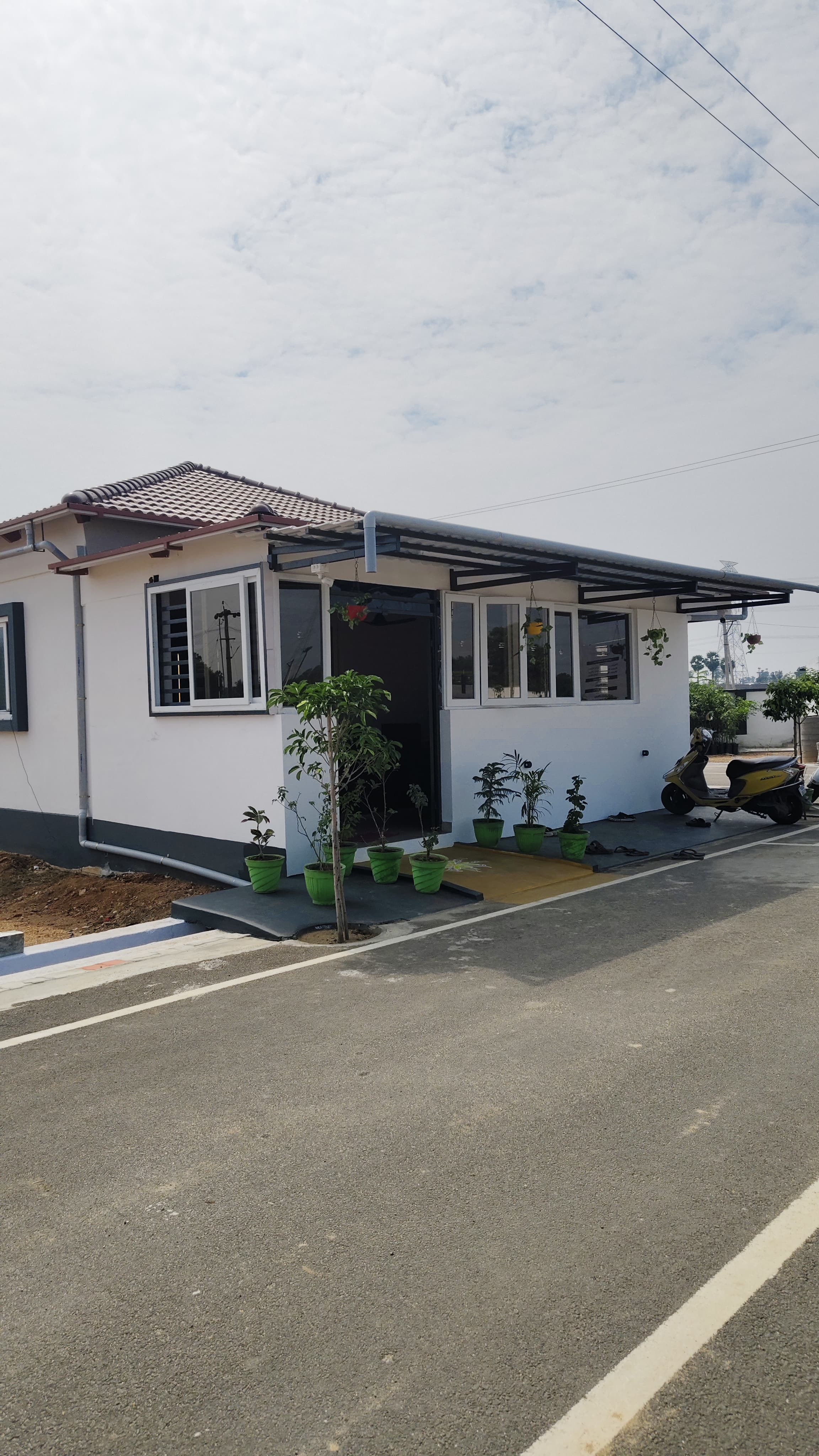 A completed model house on the plot, ready to construct