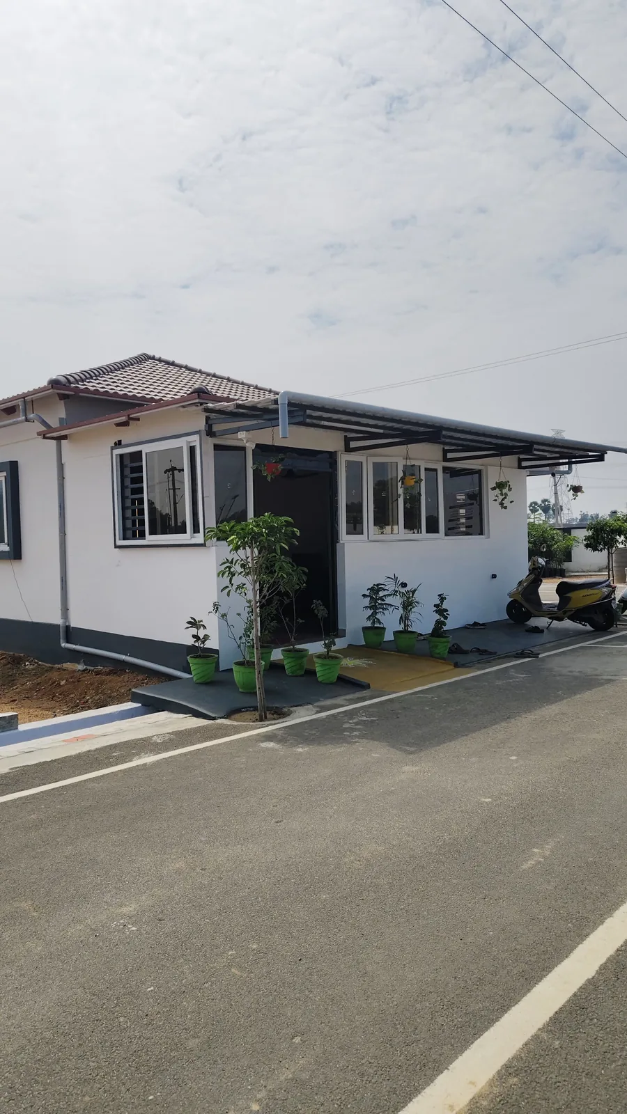 A completed model house on the plot, ready to construct